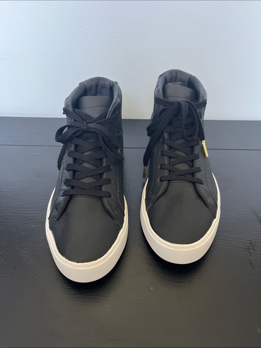Adidas W/7.5 Black High-Top Sneakers/ white sole and gold logo.